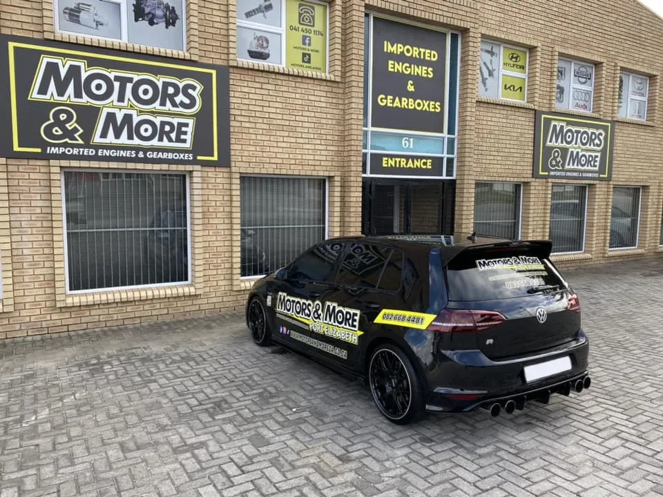 Close-up of Motors & More Gqeberha entrance with branded car in front