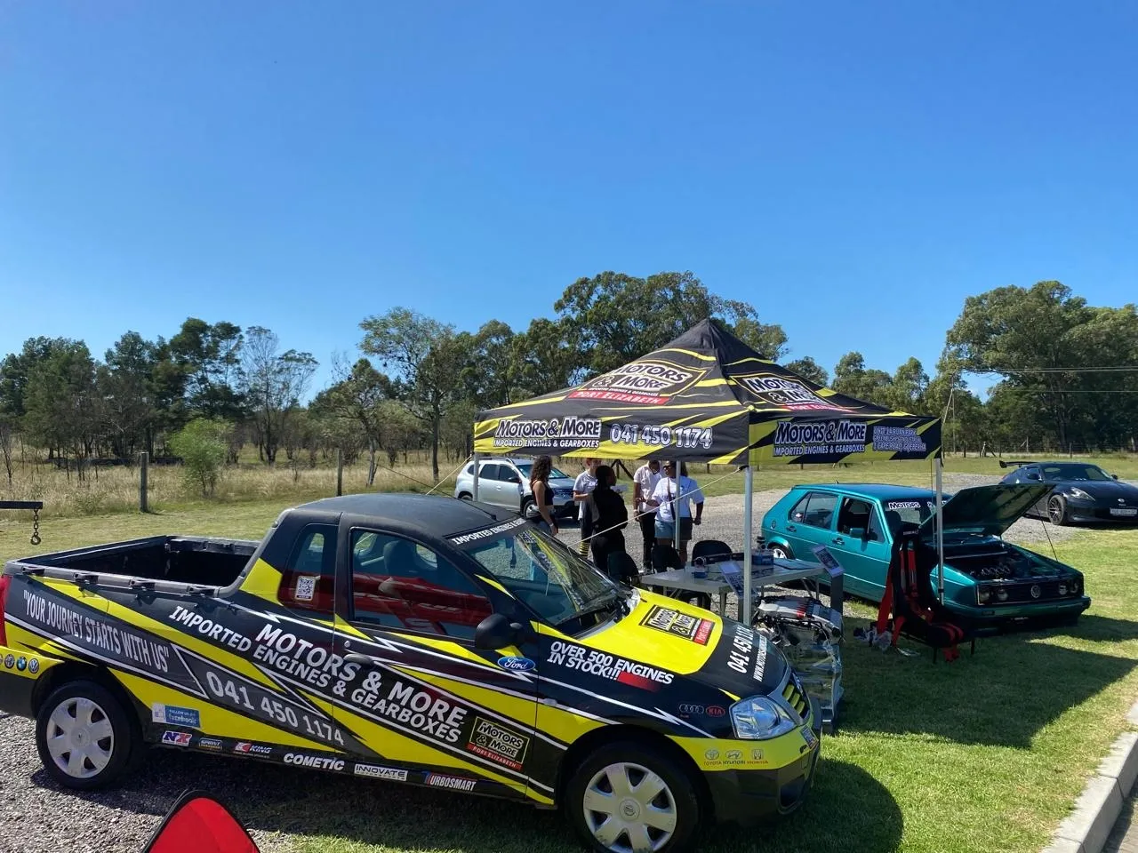 Motors & More Gqeberha branded marquee at an outdoor event