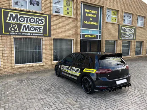Close-up of Motors & More Gqeberha entrance with branded car in front